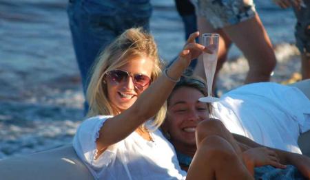 a beatiful girl, champagne, sea, good sound & sunshine welcome to the real world..